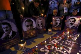 Demonstrators hold candles and pictures of Armenian victims during a commemoration for the victims of mass killings of Armenians by Ottoman Turks, in Istanbul [REUTERS]