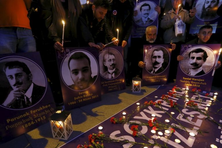 Demonstrators hold candles and pictures of Armenian victims during a commemoration for the victims of mass killings of Armenians by Ottoman Turks, in Istanbul [REUTERS]