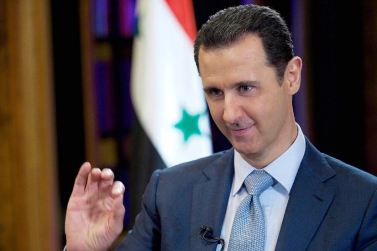 Syrian President Bashar Assad gestures during an interview with the BBC, in Damascus, Syria [AP]
