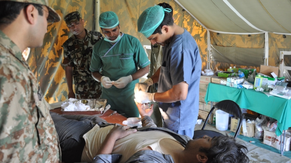 Pakistan's army field hospital was established at Bakhtapur neighbourhood of Khatmandu [Al Jazeera]Search and rescue operation have continued on Wednesday with little hope of finding survivors [Al Jazeera]
