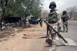 In this April 8, 2015 photo, Nigerian soldiers man a checkpoint in Gwoza, Nigeria, a town newly liberated from Boko Haram [File: Lekan Oyekanmi/AP Photo]