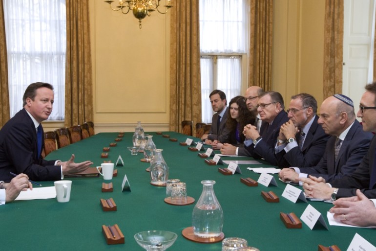 British PM David Cameron talks with members of the Jewish Leadership Council [AP]