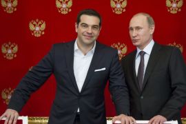 Putin and Tsipras attend a signing ceremony at the Kremlin in Moscow [REUTERS]