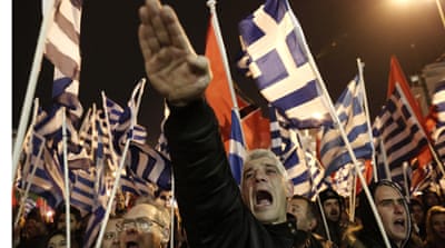 Supporters of Greece's extreme-right party Golden Dawn during a rally in Athens [AP]