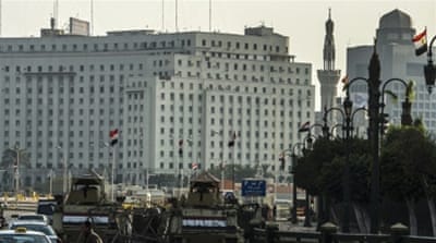 Egyptian army armoured personnel carriers parked in Cairo's Tahrir Square in November 2014 [Getty]