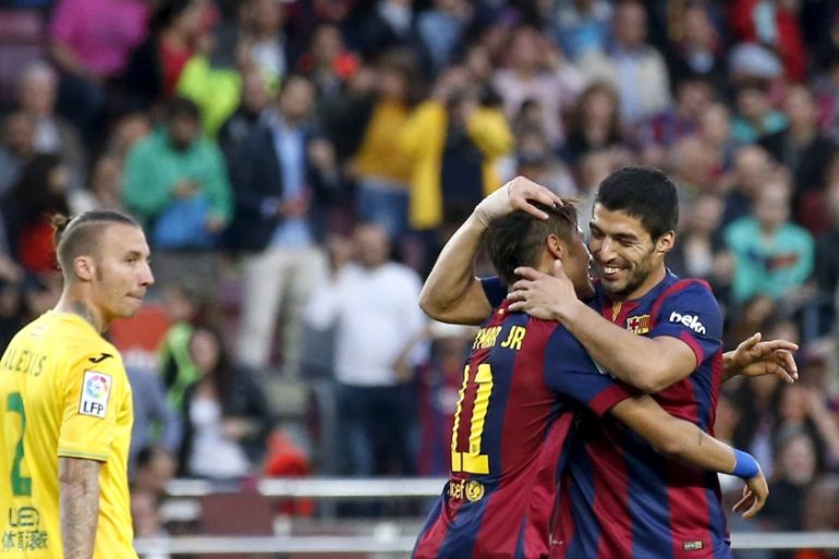 Barcelona''s Luis Suarez celebrates his second goal against Getafe with teammate Neymar during their Spanish first division soccer match at Nou Camp stadium in Barcelona