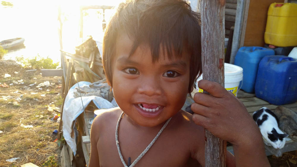 A Bajau Laut child in Kampung Halo, Semporna [Chan Tau Chou/Al Jazeera]