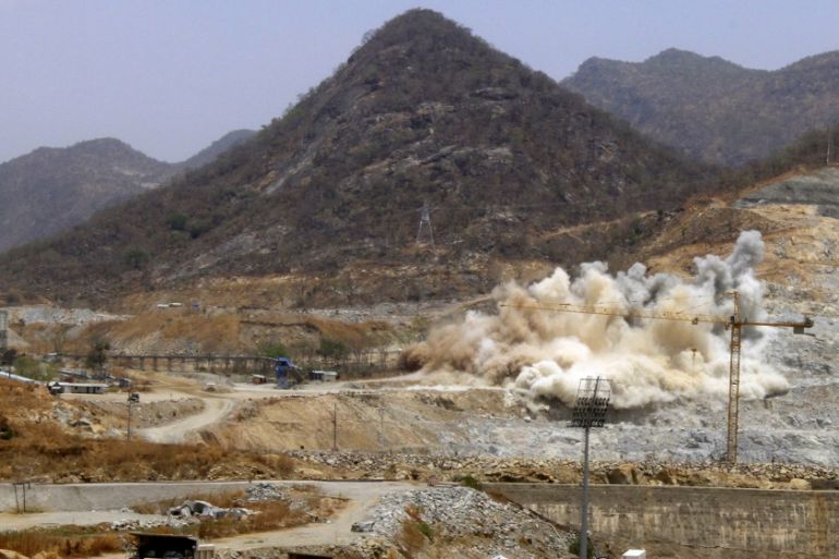 A cloud of dust rises from a dynamite blast, as part of construction work, at Ethiopia''s Grand Renaissance Dam [REUTERS]