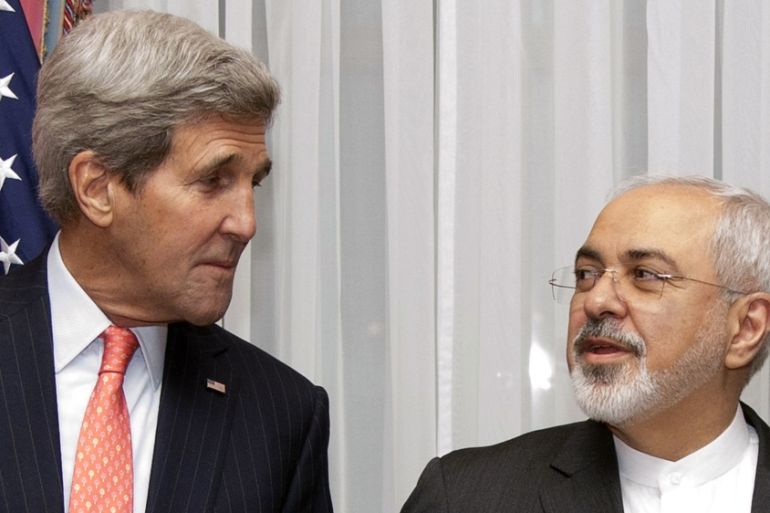 US Secretary of State John Kerry listens to Iran''s Foreign Minister Mohammad Javad Zarif [AP]