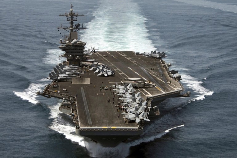 The aircraft carrier USS Theodore Roosevelt operates in the Arabian Sea conducting maritime security operations