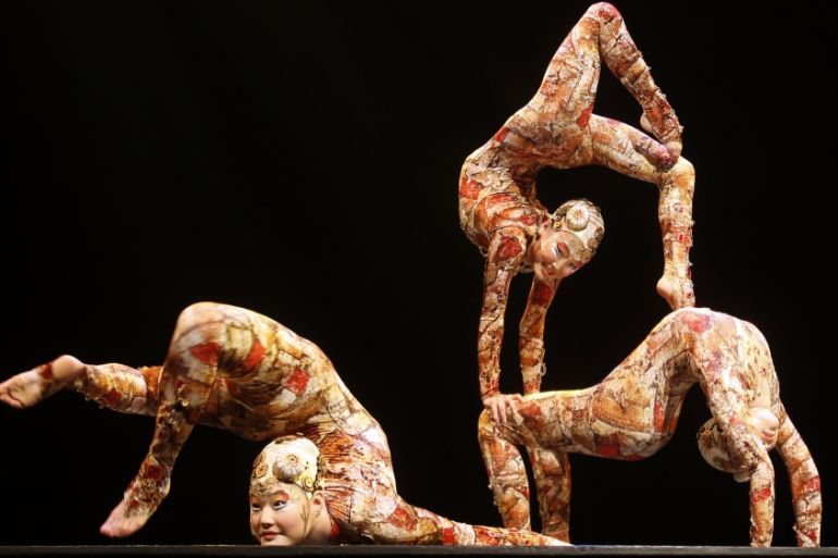 Contortion artists perform during the Cirque du Soleil''s Kooza show in Madrid [REUTERS]