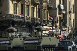 Egyptian army armoured personnel carriers parked in Cairo''s Tahrir Square in November 2014 [Getty]
