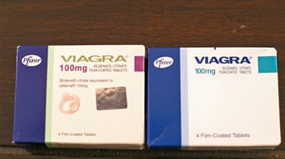 Fake Viagra (left) and genuine Viagra (right) [Mark Dobbin/Al Jazeera]