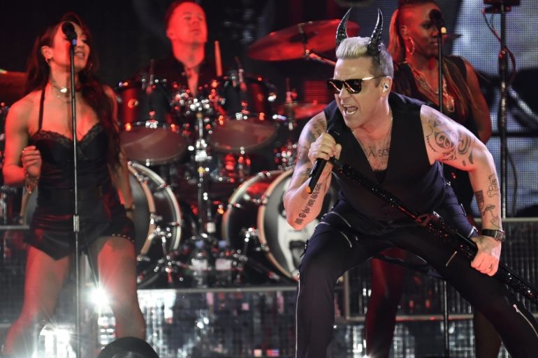 British singer Robbie Williams performs during a concert in Linz, Austria [EPA]