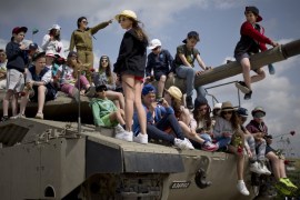 School children listen to an Israeli soldier speaking about Israel''s wars before a ceremony marking Memorial Day for soldiers and civilians killed in conflict between Jews and Arabs [AP]