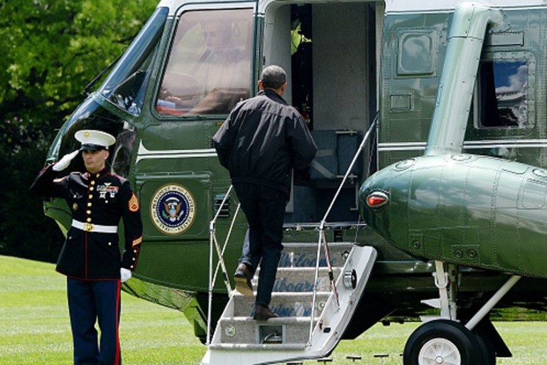 Obama walks on to Marine One on the South Lawn of the White House prior to his departure to Camp David [Getty]