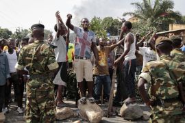 Opposition demonstrators confront army soldiers in Bujumbura, Burundi [AP]