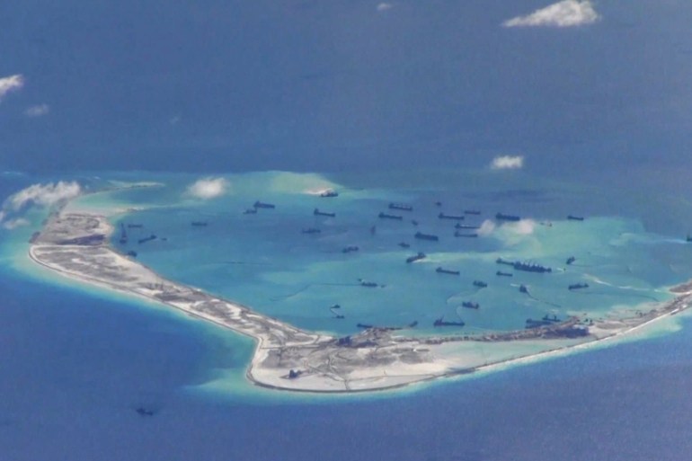 File still image from United States Navy video purportedly shows Chinese dredging vessels in the waters around Mischief Reef in the disputed Spratly Islands