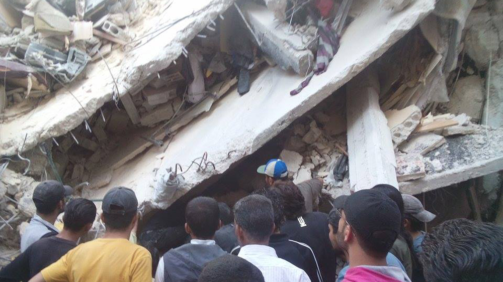 Activists said government helicopters dropped several barrel bombs over the Damascus district of Yarmouk [Ahmad/Al Jazeera]