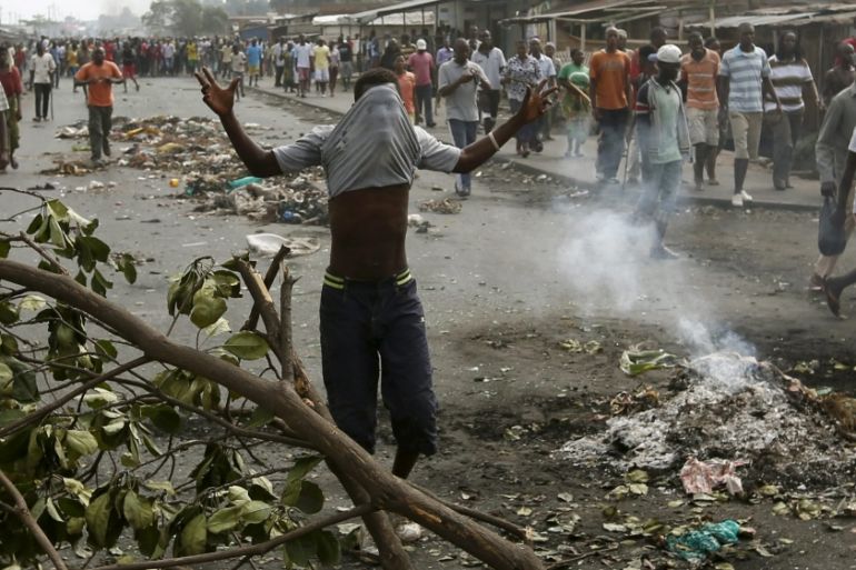 A protester walks during a protest against President Pierre Nkurunziza and his bid for a third term, in Bujumbura