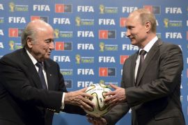 File picture of Russian President Putin and FIFA President Blatter taking part in the official handover ceremony for the 2018 World Cup in Rio de Janeiro