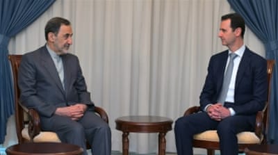 Assad meets with Ali Akbar Velayati, an adviser to Iran's Ayatollah Ali Khamenei, in Damascus [AP]