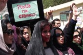 Afghan women chant slogans during a protest demanding justice for a woman who was beaten to death by a mob [Getty]