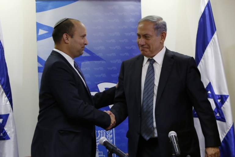 Netanyahu with the head of the right-wing Jewish Home party, Naftali Bennett [AFP]