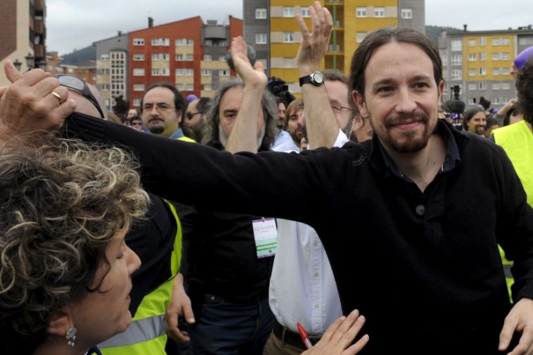 Podemos Secretary General Pablo Iglesias waves as he arrives at an electoral meeting in Oviedo, Spain [REUTERS]