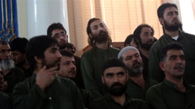 Defendants attend their trial at the Primary Court in Kabul [AP]