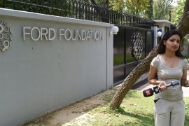 An Indian television journalist reports outside the office of the Ford Foundation in New Delhi [AFP]