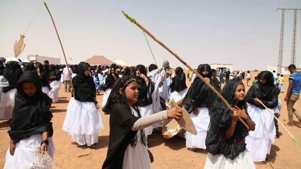 Children in landlocked refugee camps in southern Algeria rally for a Western Sahara homeland [Hannah McNeish/Al Jazeera]