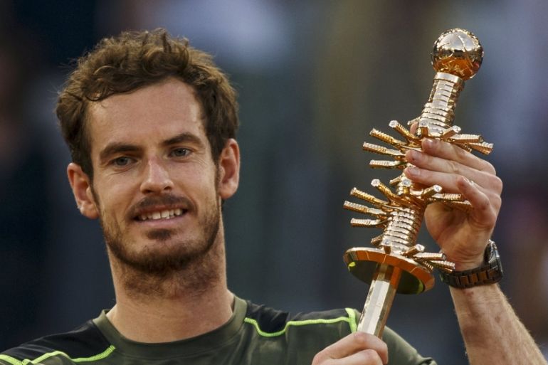 Britain''s Murray raises up his trophy after winning the final match over Spain''s Nadal at the Madrid Open tennis tournament in Madrid