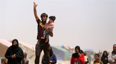 Displaced civilians from Ramadi in a camp in a town west of Baghdad [AP]