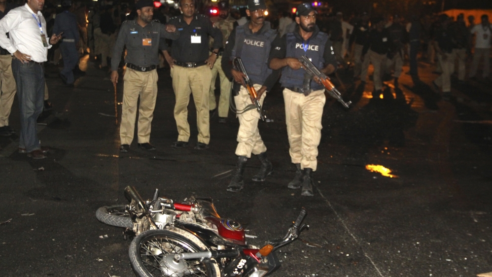 Police inspect the site of a blast that occurred near Gaddafi Stadium in Lahore [Reuters]