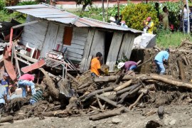 Residents remove mud and debris as they search for bodies after a landslide in the municipality of Salgar, in Antioquia department