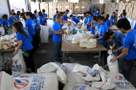 Volunteers repack food rations for victims of Typhoon Noul at the Department of Social Welfare Development (DSWD) headquarters in Pasay city, south of Manila May 9, 2015.