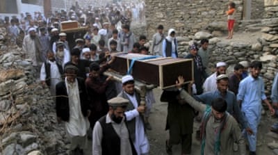 Relatives and residents carry the coffins of victims after a suicide attack in Jalalabad [REUTERS]