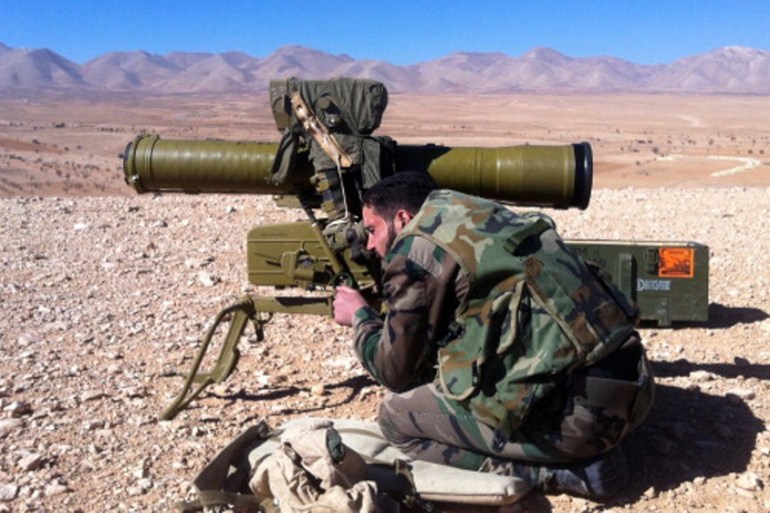 A pro regime soldier aims a rocket launcher towards rebel locations in the Qalamoun region [AFP]
