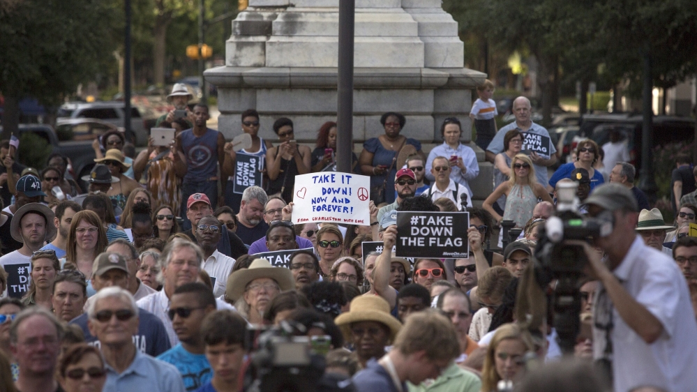 People gather at a rally calling for the Confederate flag to be taken down, at the South Carolina State House Building in Columbia, South Carolina [EPA]