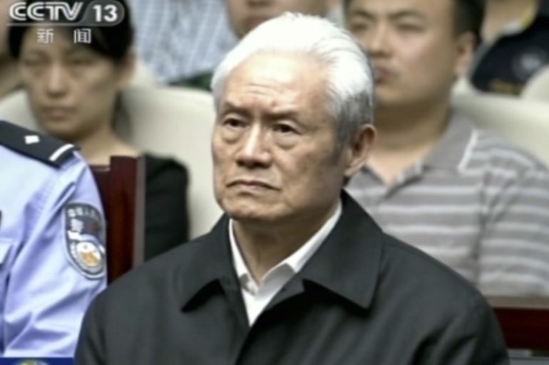 Zhou Yongkang, formerly the Chinese Communist Party Politburo Standing Committee member in charge of security, sits in a courtroom in China [AP]