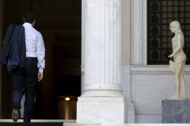 Greek PM Tsipras arrives at his office in Maximos Mansion in Athens