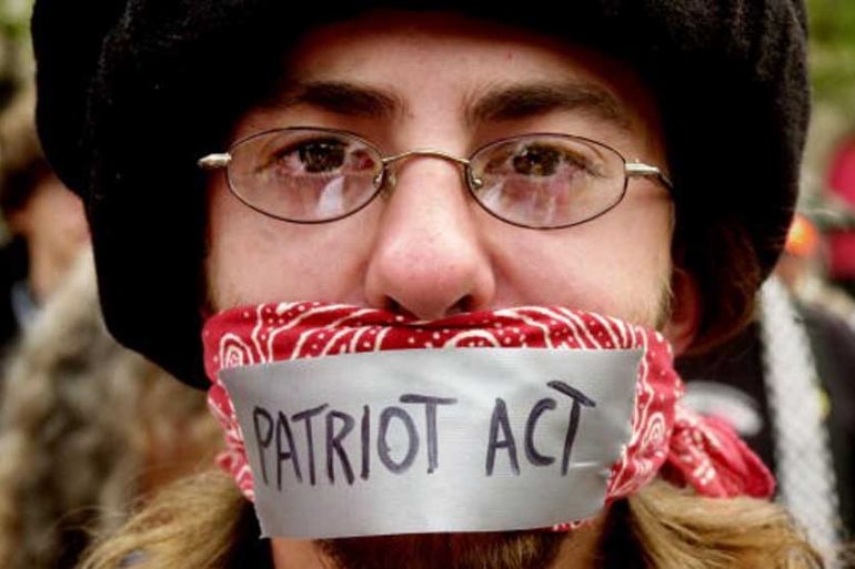 A man protests the Patriot Act during an anarchist rally on the final day of the Democratic National Convention at Copley Plaza in 2004 [Getty]
