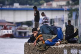 Migrants lying under a bridge on a bank of the river Sava in Belgrade, as they rest on their way to the Hungarian-Serbian border [AFP]