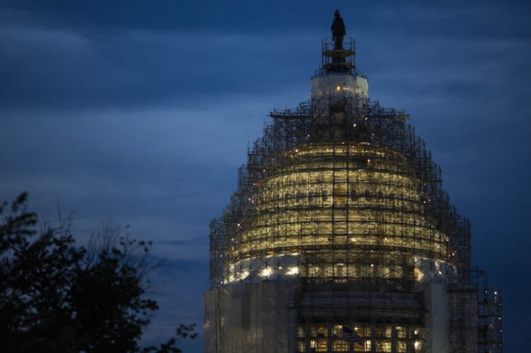 The US Capitol is illuminated at dusk in Washington, DC [Getty]