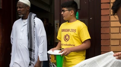 A volunteer collects donations at the East London Mosque [Getty]