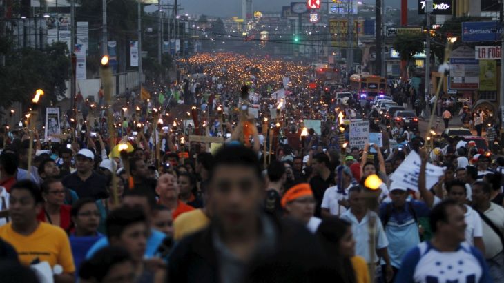 People take part in a march to demand the resignation of Honduras'' President Hernandez in Tegucigalpa