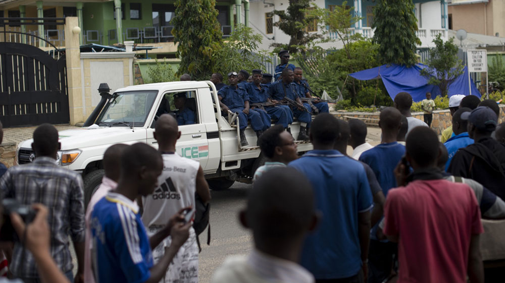 Armed police drive past a group of students taking refuge next to the US embassy as a deadline for them to leave approaches. The previous day, the government had given students 24 hours to leave the site, and they had heard that police were coming to forcibly remove them [Phil Moore/Al Jazeera]