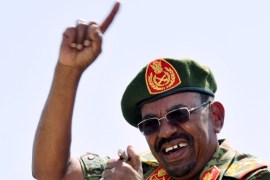 Sudanese President Omar Hassan al-Bashir gestures