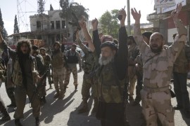 Members of al Qaeda''s Nusra Front cheer in the northwestern city of Ariha, after a coalition of insurgent groups seized the area in Idlib province [REUTERS]